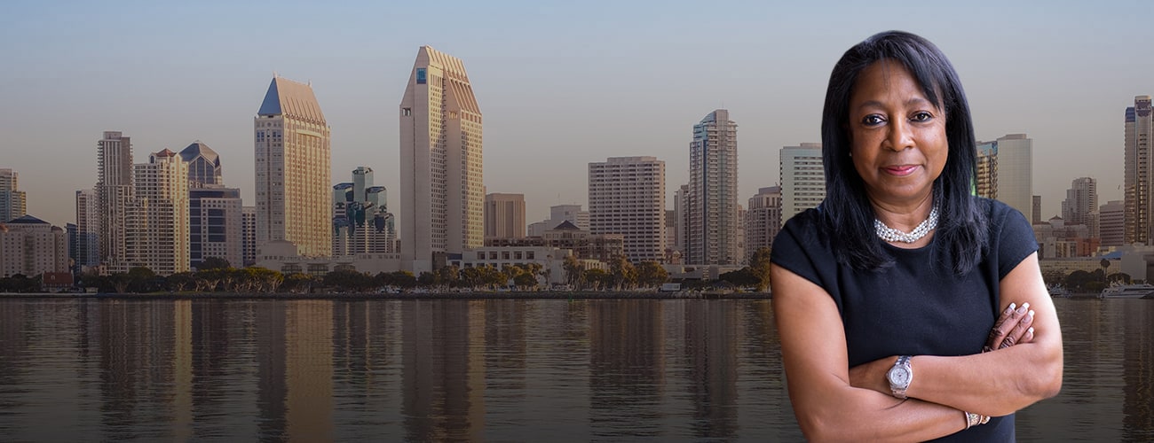 Hero Banner - Picture of Denise E. Oxley over a skyline of San Diego, CA